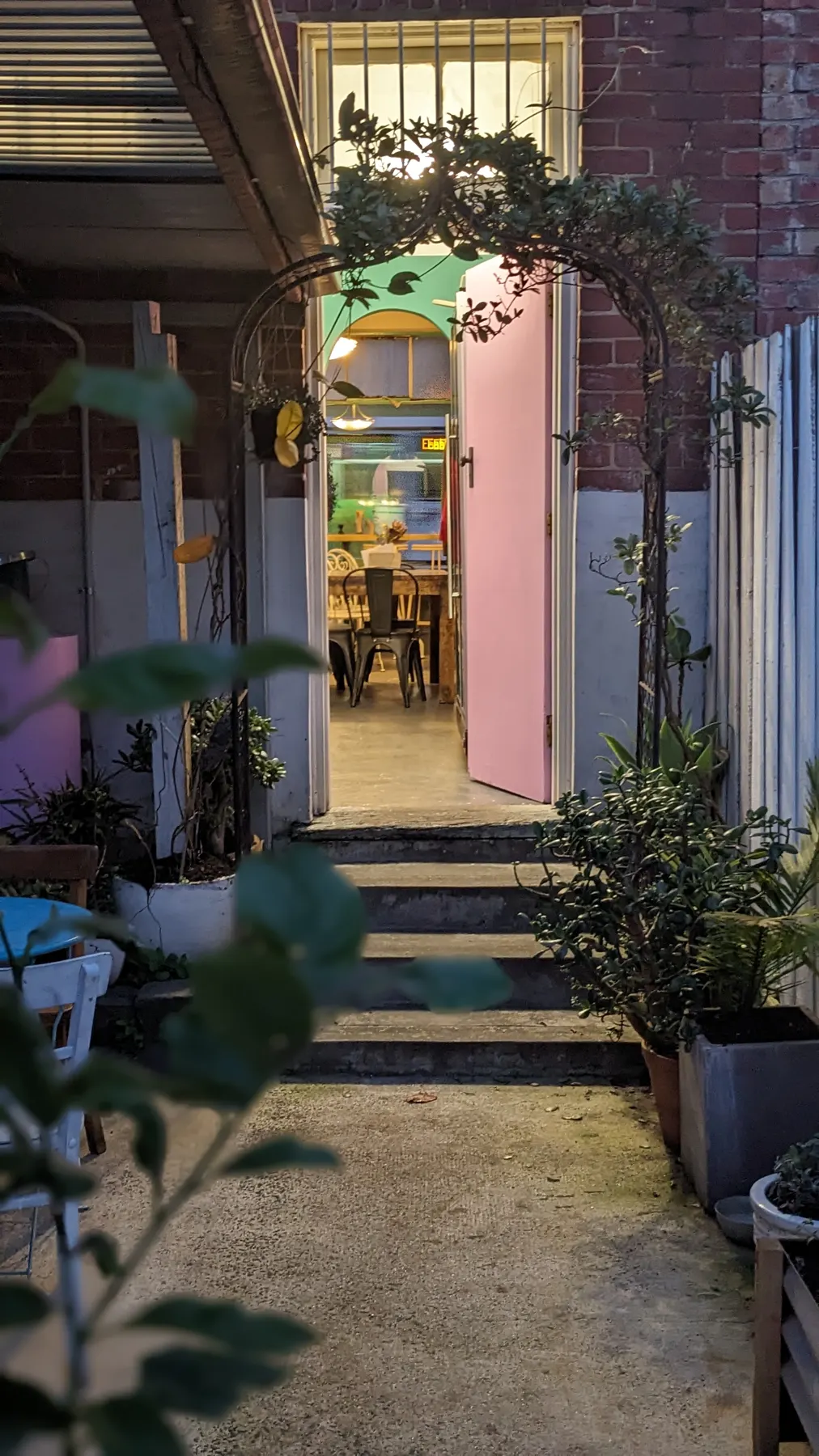 The courtyard and the pink door into the lounge at Big Elma.