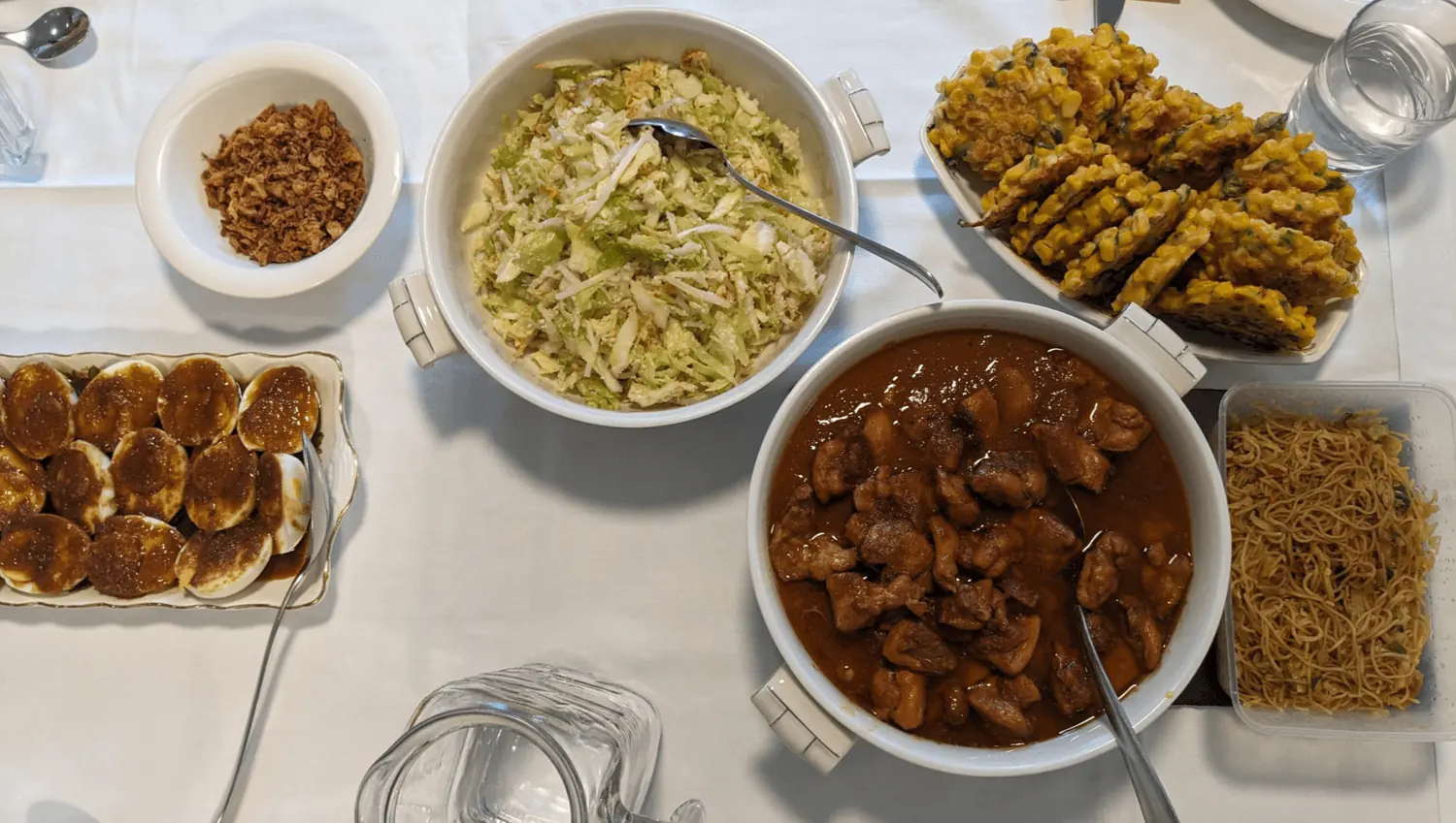 A shared table of rice, satay, vegetables and noodles from a Big Elma pop-up.